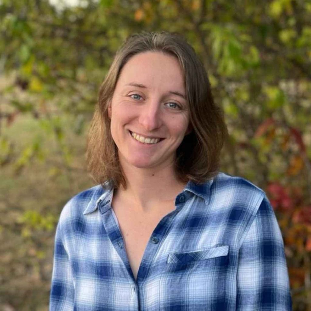 casie in front of trees