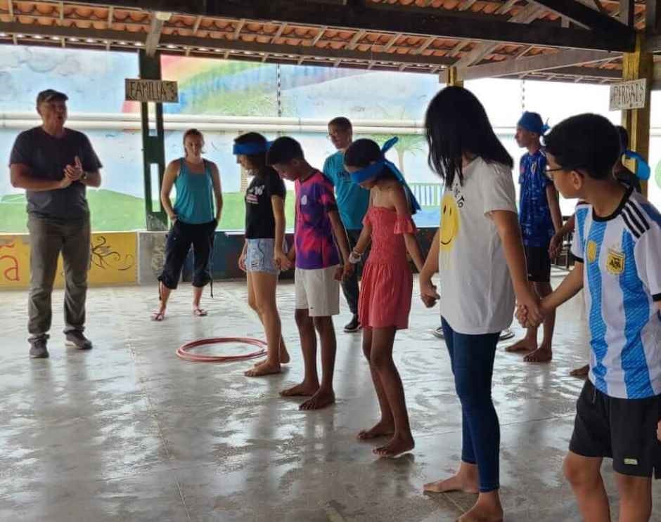 Group of cbc students playing game with Marc directing them