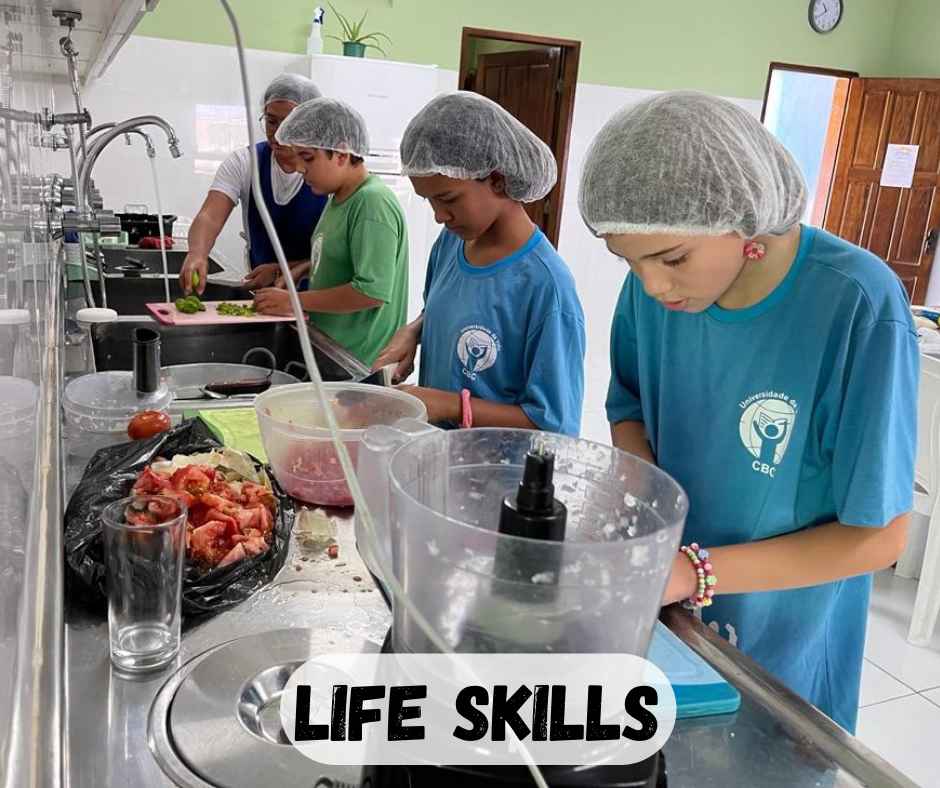 teens in the kitchen helping prepare a hot meal for other students